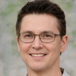 Joyful white adult male with short  brown hair and grey eyes