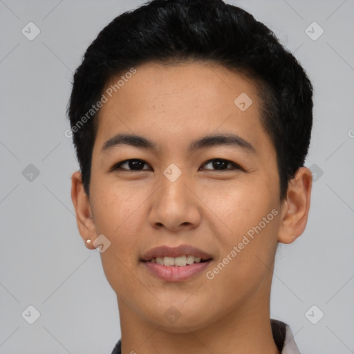 Joyful asian young-adult male with short  black hair and brown eyes