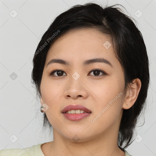 Joyful asian young-adult female with medium  brown hair and brown eyes