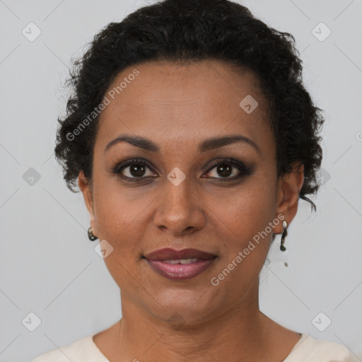 Joyful black adult female with short  brown hair and brown eyes