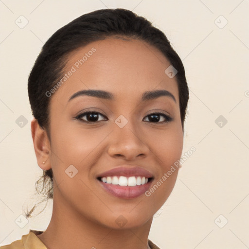 Joyful latino young-adult female with long  black hair and brown eyes