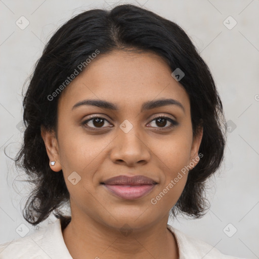 Joyful latino young-adult female with medium  brown hair and brown eyes