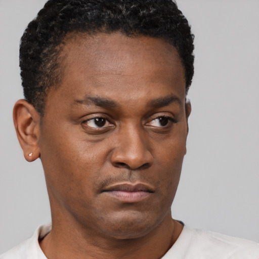 Neutral black young-adult male with short  brown hair and brown eyes