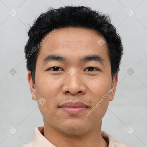 Joyful asian young-adult male with short  black hair and brown eyes