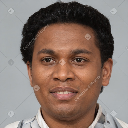 Joyful latino young-adult male with short  brown hair and brown eyes