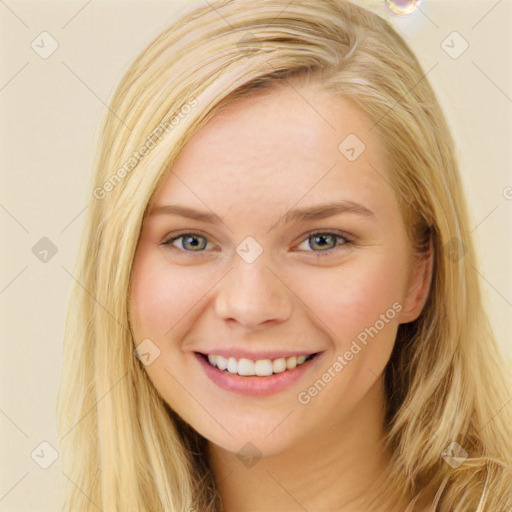 Joyful white young-adult female with long  brown hair and blue eyes