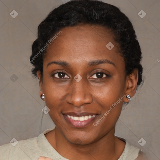 Joyful black young-adult female with short  brown hair and brown eyes