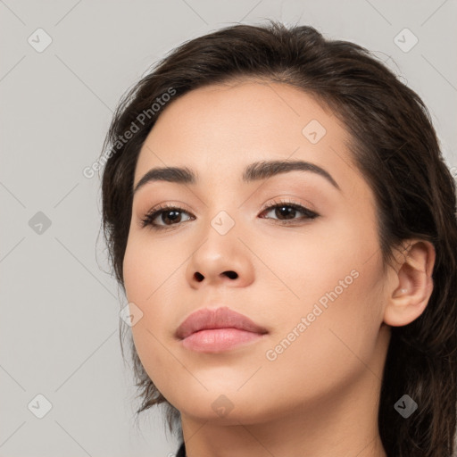 Neutral white young-adult female with long  brown hair and brown eyes