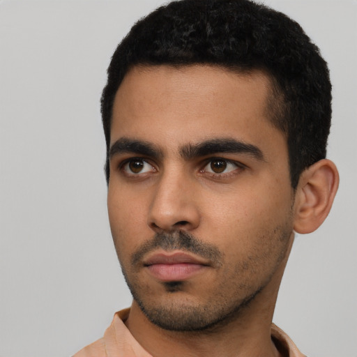 Neutral latino young-adult male with short  black hair and brown eyes