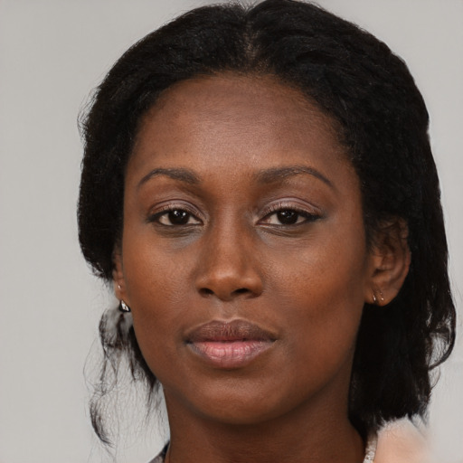 Neutral black adult female with medium  black hair and brown eyes