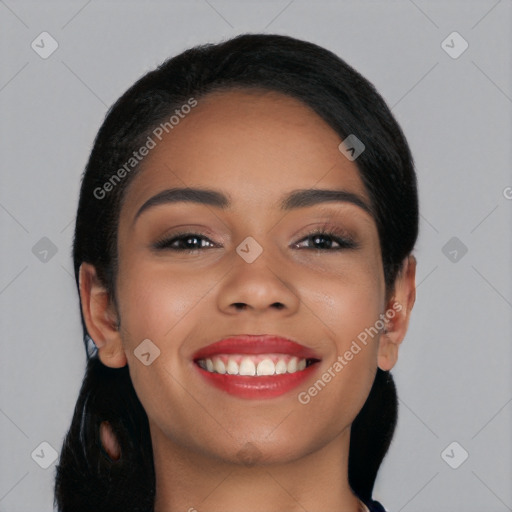 Joyful latino young-adult female with long  black hair and brown eyes