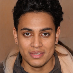 Joyful latino young-adult male with short  brown hair and brown eyes