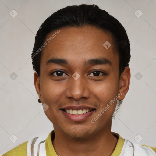 Joyful latino young-adult male with short  black hair and brown eyes