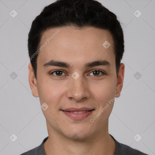 Joyful white young-adult male with short  black hair and brown eyes