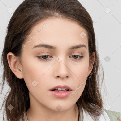 Neutral white young-adult female with long  brown hair and brown eyes