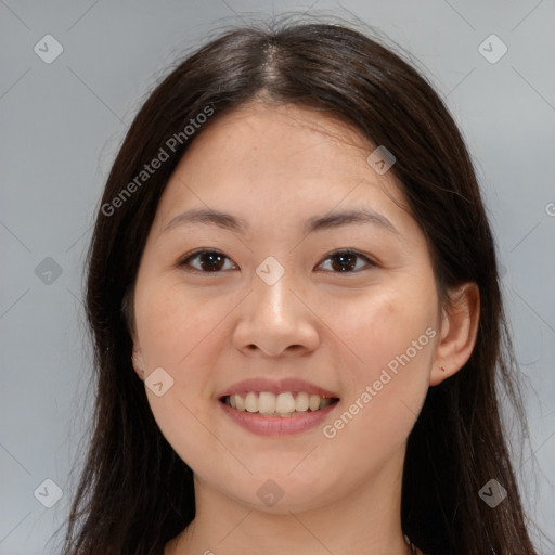 Joyful asian young-adult female with long  brown hair and brown eyes