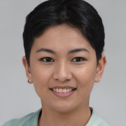 Joyful asian young-adult female with short  brown hair and brown eyes