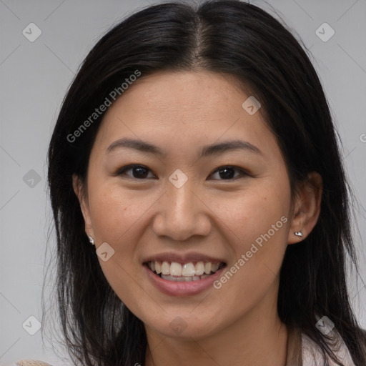 Joyful latino young-adult female with medium  brown hair and brown eyes