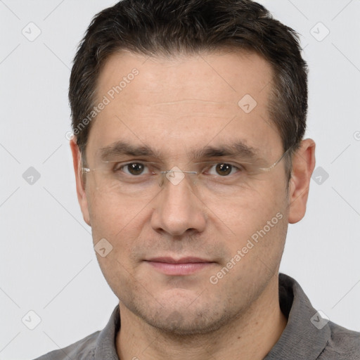 Joyful white adult male with short  brown hair and brown eyes