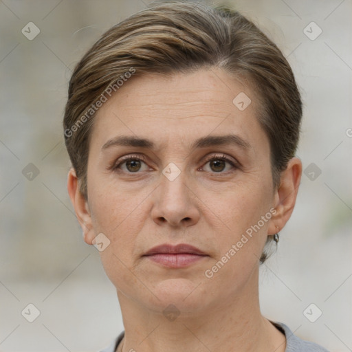 Joyful white adult female with short  brown hair and grey eyes