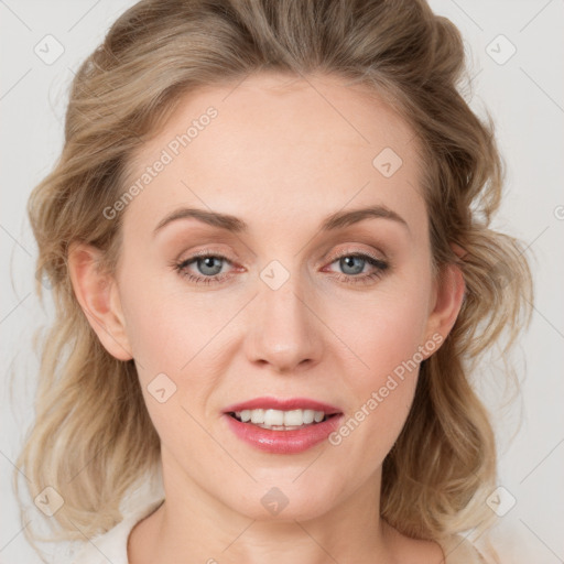 Joyful white young-adult female with medium  brown hair and blue eyes