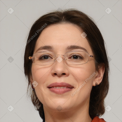 Joyful white adult female with medium  brown hair and brown eyes