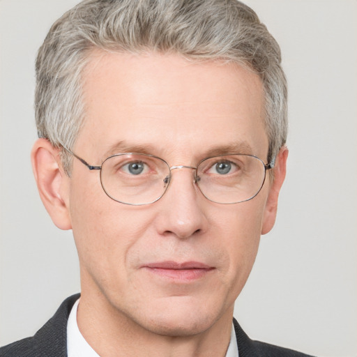 Neutral white middle-aged male with short  gray hair and blue eyes