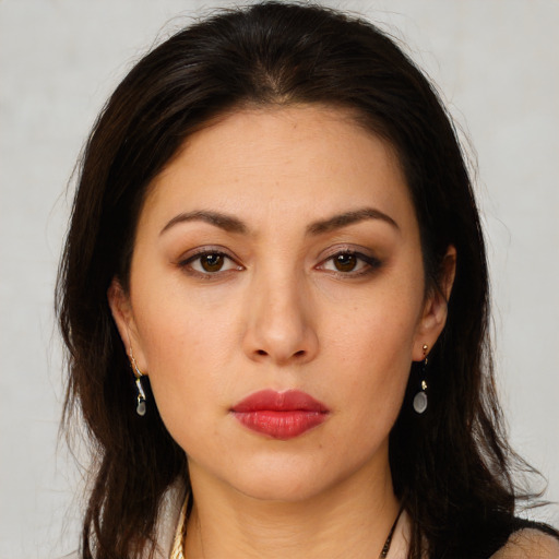 Neutral white young-adult female with long  brown hair and brown eyes
