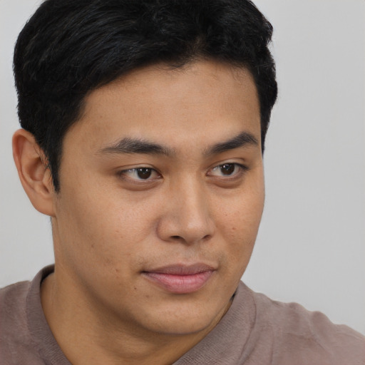 Neutral latino young-adult male with short  brown hair and brown eyes
