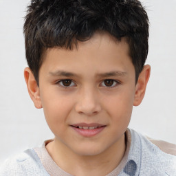 Joyful white child male with short  brown hair and brown eyes