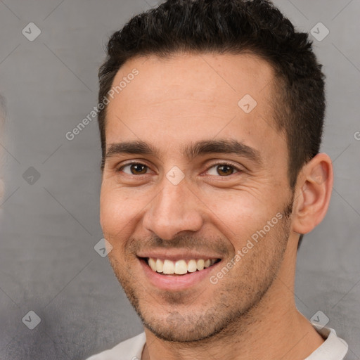 Joyful white young-adult male with short  brown hair and brown eyes