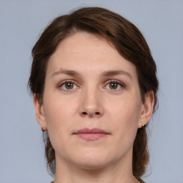 Neutral white young-adult female with medium  brown hair and brown eyes