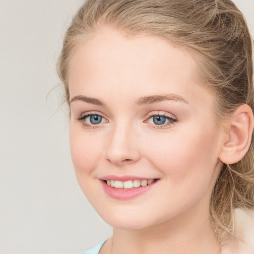 Joyful white young-adult female with long  brown hair and green eyes