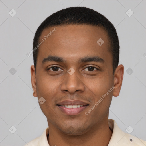 Joyful black young-adult male with short  black hair and brown eyes