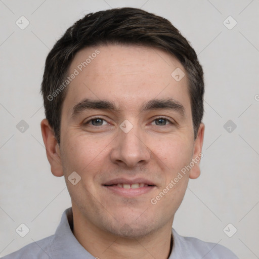 Joyful white young-adult male with short  black hair and brown eyes