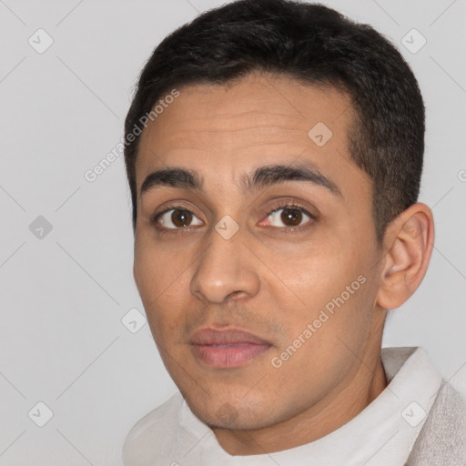 Neutral white young-adult male with short  black hair and brown eyes