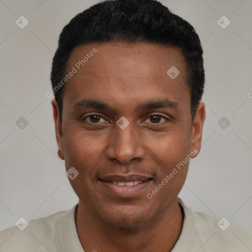 Joyful black young-adult male with short  black hair and brown eyes