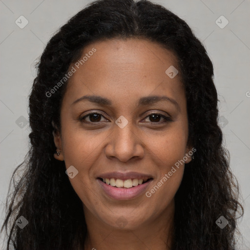 Joyful black young-adult female with long  brown hair and brown eyes