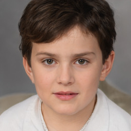 Joyful white child male with short  brown hair and brown eyes