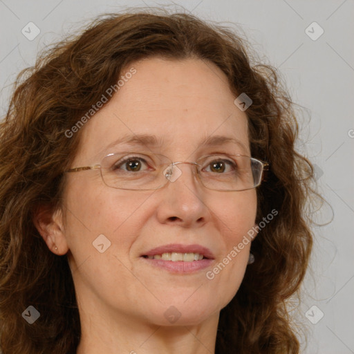 Joyful white adult female with long  brown hair and green eyes