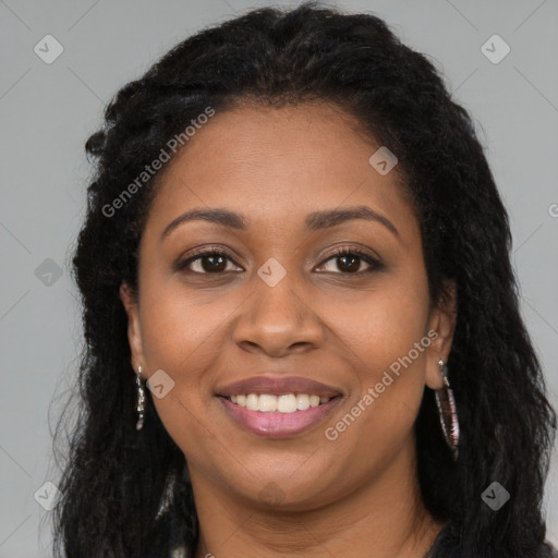 Joyful black young-adult female with long  brown hair and brown eyes