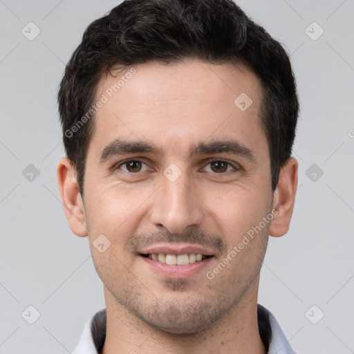 Joyful white young-adult male with short  brown hair and brown eyes