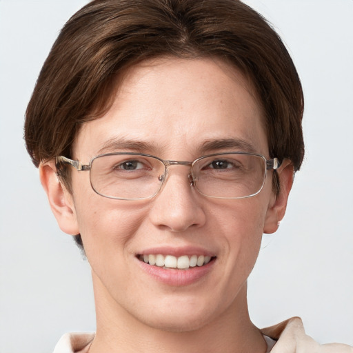 Joyful white adult female with short  brown hair and grey eyes