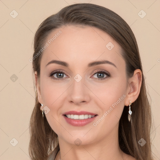 Joyful white young-adult female with long  brown hair and grey eyes