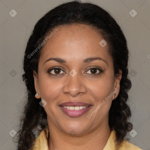 Joyful black adult female with medium  brown hair and brown eyes