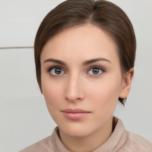 Neutral white young-adult female with short  brown hair and brown eyes