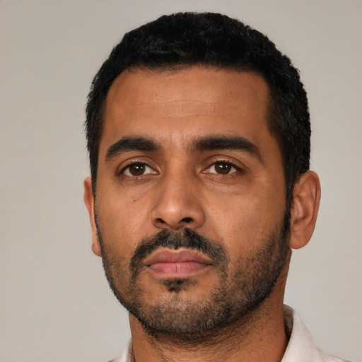 Neutral latino young-adult male with short  black hair and brown eyes
