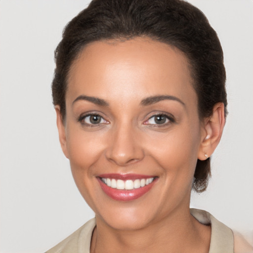 Joyful white young-adult female with short  brown hair and brown eyes