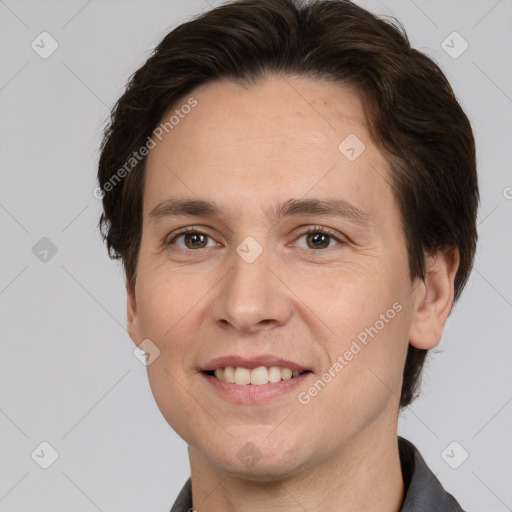 Joyful white adult male with short  brown hair and grey eyes