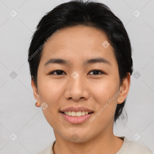 Joyful asian young-adult female with short  black hair and brown eyes